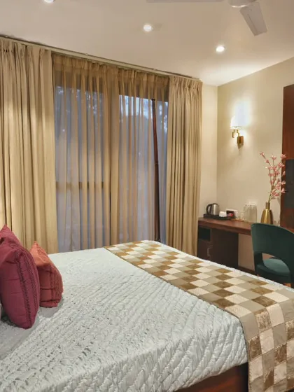This angle shows the functional layout of the homestay bedroom, including a dedicated work desk and TV unit. We ensured that every element, from the furniture to the lighting, contributes to a cohesive and high-end guest experience.