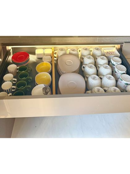 A dedicated drawer for tea and coffee service. Cups, saucers, and small plates are neatly arranged with dividers, making it easy to host guests.