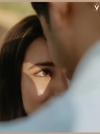 An artistic close-up focusing on the bride's eye, with a sliver of light creating a beautiful play of shadow and light across her face. This frame highlights our focus on fine art storytelling and detail.