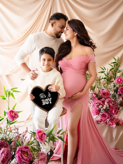 The whole family together for a gender reveal. It's a boy. The joy and love in this photo are just overflowing.