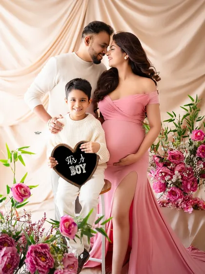 The whole family together for a gender reveal. It's a boy. The joy and love in this photo are just overflowing.