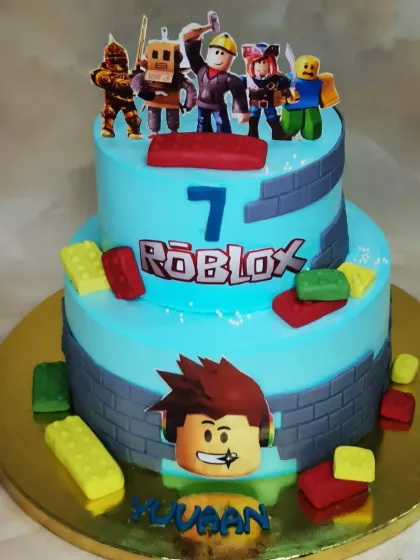 This two-tier Roblox cake is ready for an adventure. Made with a fresh pineapple flavor, it captures the blocky, fun aesthetic of the popular game, making it a hit with kids.