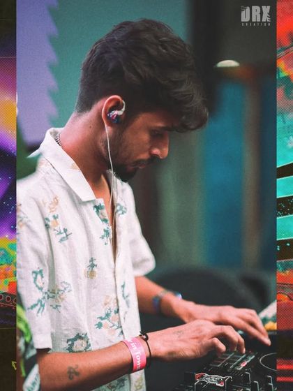 A focused shot of me finger-drumming on the pads during a battle. Every beat has to be precise to match the dancers' energy.