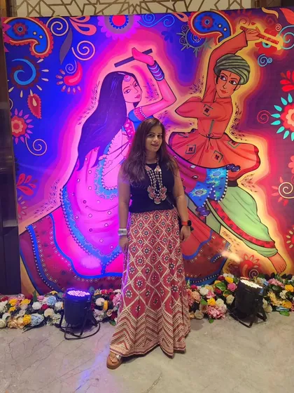 For a Dandiya night, I created a fusion look that was both festive and versatile. I paired a traditional skirt with a modern black top and a long necklace to create a height advantage, finishing with comfortable block heels for a night of dancing.