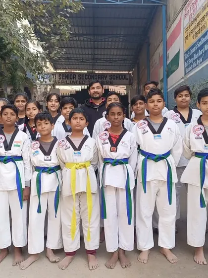 Another group of proud students after receiving their new belts. Their hard work in class has paid off.