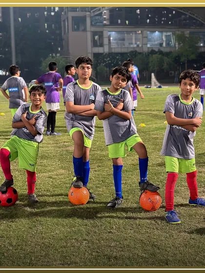 Our young wolves posing with their footballs, ready to take on any challenge. We build confidence and a winning attitude from the start.