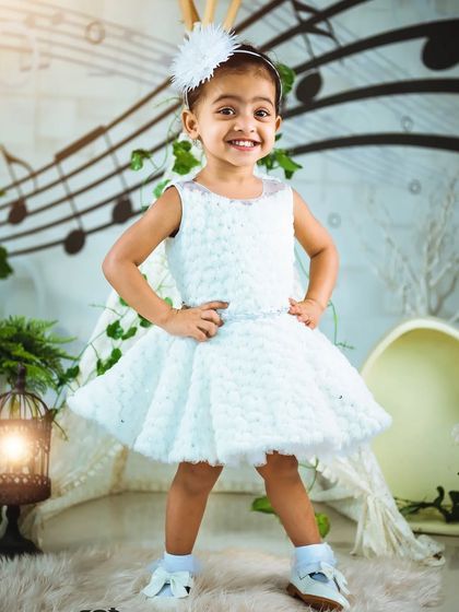 This toddler is ready to strike a pose! I make my sessions fun and engaging for older kids to capture their confident and playful personalities.