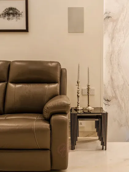 A close-up of the plush leather recliner and the elegant nesting side tables. These details show our commitment to providing comfortable and stylish furniture for every space.