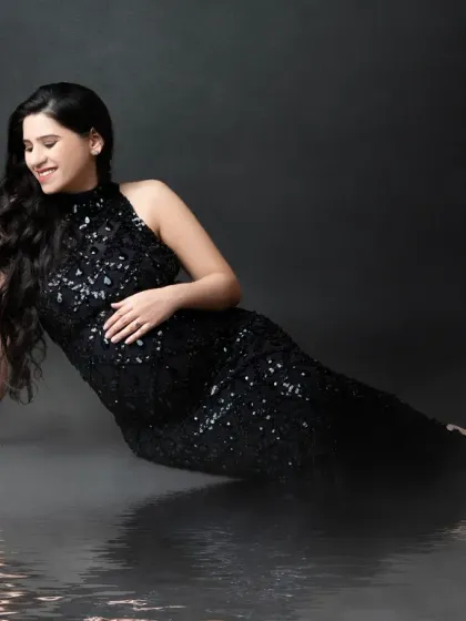 A glamorous pose on our reflective floor. The black sequin gown shimmers, and the misty effect on the floor adds a touch of drama and sophistication.