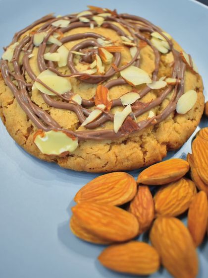 This is not your regular cookie. My Almond Croissant Cookie is soft and golden, filled with a rich chocolate frangipane and topped with toasted almond slivers for a buttery crunch.