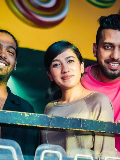 A group of friends enjoying the view from the balcony.