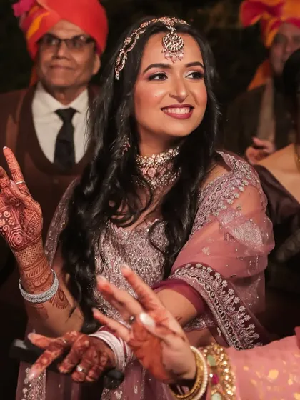 Another candid moment of my client enjoying the wedding festivities. Her makeup looks fresh and flawless even while dancing.