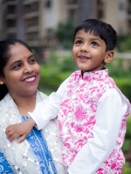 A candid moment between a mother and her son during an outdoor family portrait session. We focus on capturing the natural love and connection within your family.