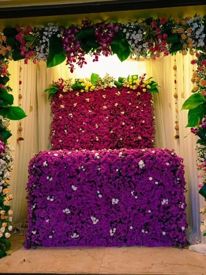 A stunning mandap completely covered in purple flowers, framed by columns of mixed fresh flowers. This design is the definition of floral luxury and makes for an unforgettable celebration.