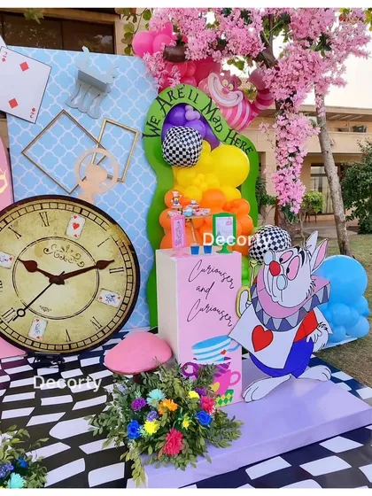 A close-up of the party decor, featuring the White Rabbit and a large clock.