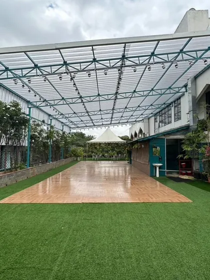 A wider view of the empty Terrace Garden space, showing the semi-covered structure which protects from sun and rain.