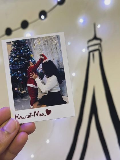 A single polaroid print featuring a sweet Christmas memory.