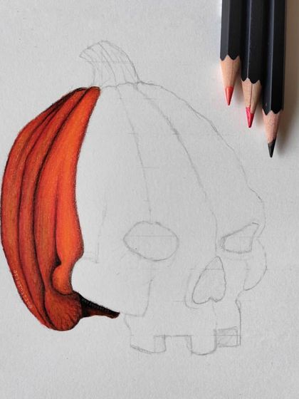 The first WIP of the pumpkin skull, showing the first section of orange being colored in.