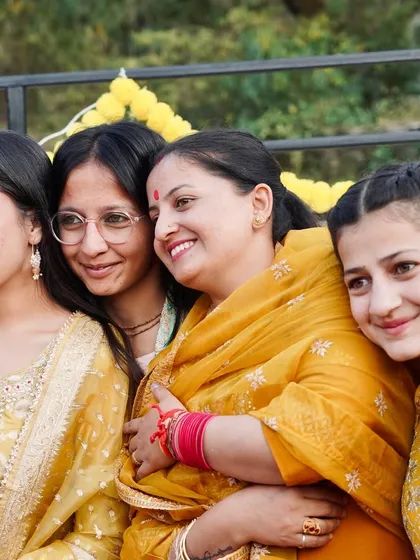 A candid group photo of smiling women enjoying the haldi function. These are the real moments of connection and friendship that I love to photograph.