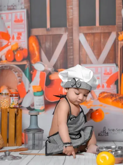 Focused on the details, this little chef is busy inspecting the ingredients. I use a variety of colorful, baby-safe props to make the scene engaging and visually rich.