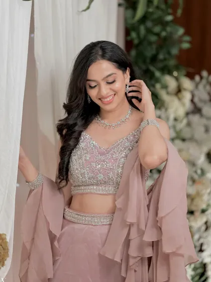 This soft glam engagement look is all about radiance. I used highlighting techniques to catch the light beautifully, making her skin look lit from within.