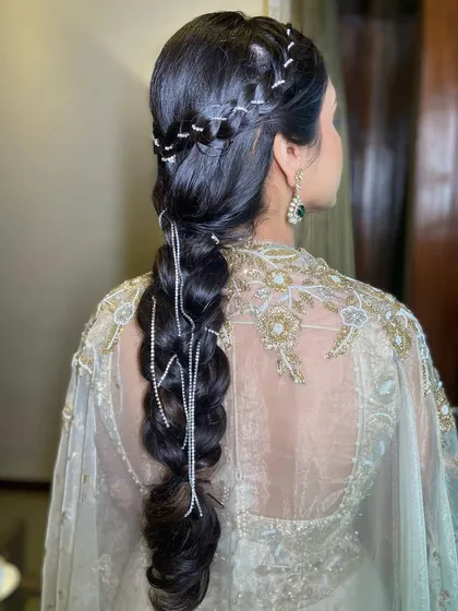 A classic braid elevated with diamond accessories, creating a look that is both traditional and modern.