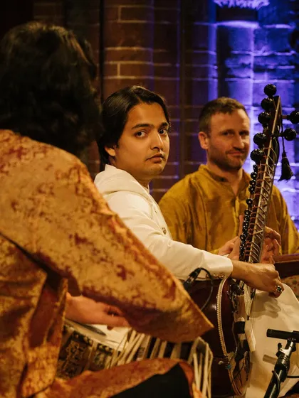 A candid moment on stage in Amsterdam, sharing a glance with my fellow musicians. The connection between artists is key to creating a cohesive and soulful performance.