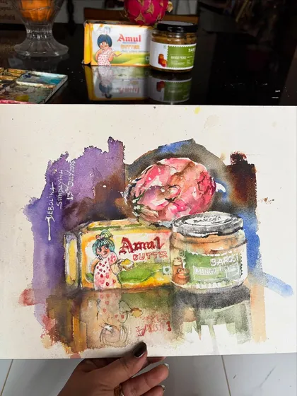 I believe art is everywhere, even on the breakfast table. This is a quick still life watercolor of an Amul butter pack and some pickle, things I literally picked from my kitchen. It’s a reminder that beauty is in the simple, everyday things.
