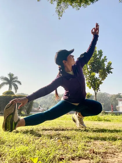 A low lunge variation practiced outdoors, connecting the body to the earth. This pose is a perfect midweek reset to recharge the mind and body amidst the chaos of life.