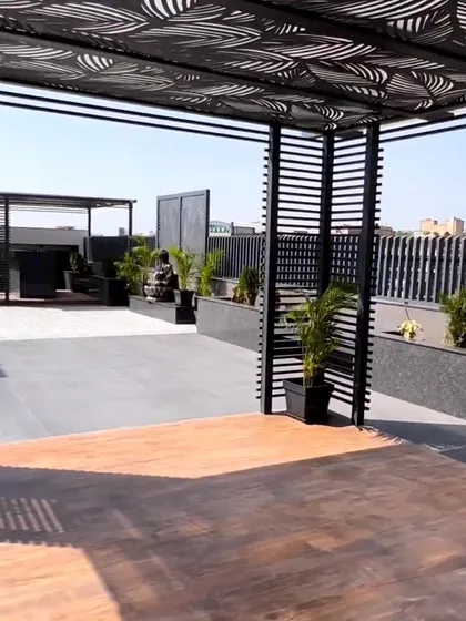 For clients seeking a bold, contemporary statement, we design and install custom metal pergolas. This expansive rooftop features multiple structures with intricate laser-cut patterns, transforming the area into a sophisticated architectural space.