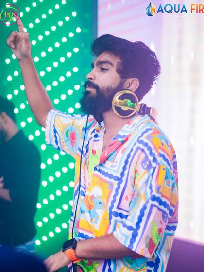 On the mic at Ginza, with my signature gold headphones. Ready to bring the energy.