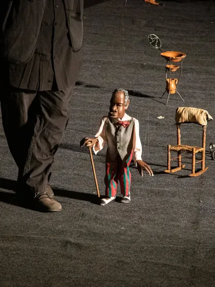 A close-up of the elderly marionette from 'Il Fil'armonico', showcasing the incredible detail and personality carved into the puppet.