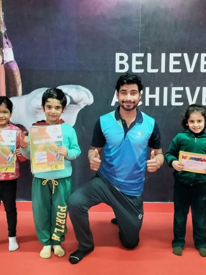 A group of our students celebrating their new certificates with their coach.