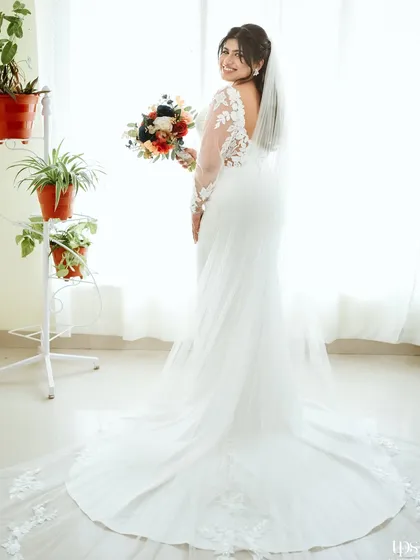 A full-length shot showing the beautiful train of the bride's wedding dress.