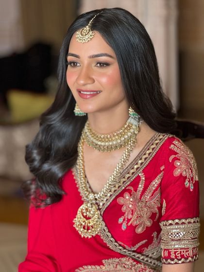 A close-up on Aashna's naturally radiant skin. The focus here is on a healthy, dewy finish, with just enough color on the cheeks and lips to look fresh and vibrant.