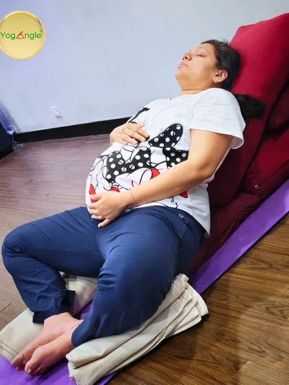 This is a space for complete relaxation and bonding. Using bolsters for support, this restorative pose helps alleviate pressure on the lower back and allows you to focus inward, nurturing the connection with your baby.