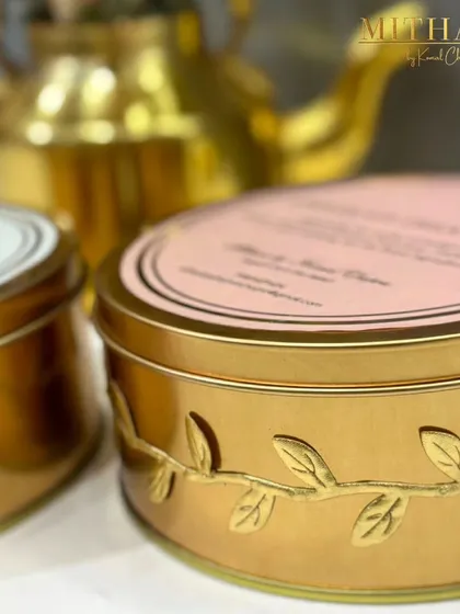 My Chocolate Dream Cake, packed in this elegant gold tin with a leaf motif, is a perfect Valentine's Day gift. It's a rich, decadent dessert designed to be shared with someone special.