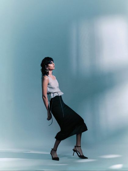 An artistic, full-body shot where the model's pose is angular and unconventional. This demonstrates my ability to direct for high-fashion, conceptual imagery.