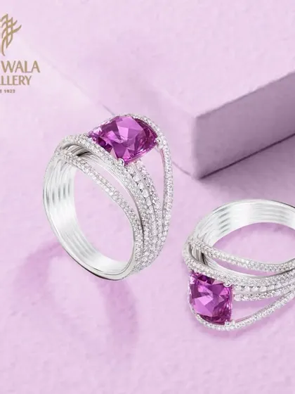 A pair of exquisite rings, one featuring a vibrant purple amethyst, showcasing our range of colourful gemstone jewellery.