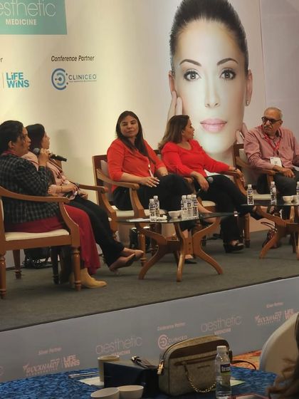 On stage with my esteemed colleagues. These discussions are vital for sharing knowledge and ensuring we are all providing the highest standard of care.