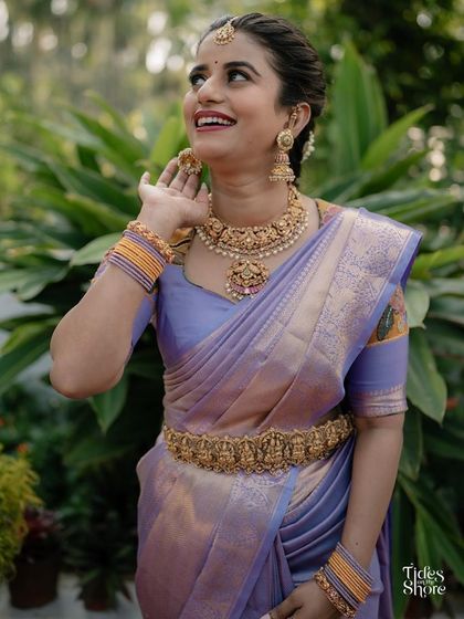 A joyful portrait of the client, highlighting her beautiful temple jewelry and the unique design of her custom blouse.