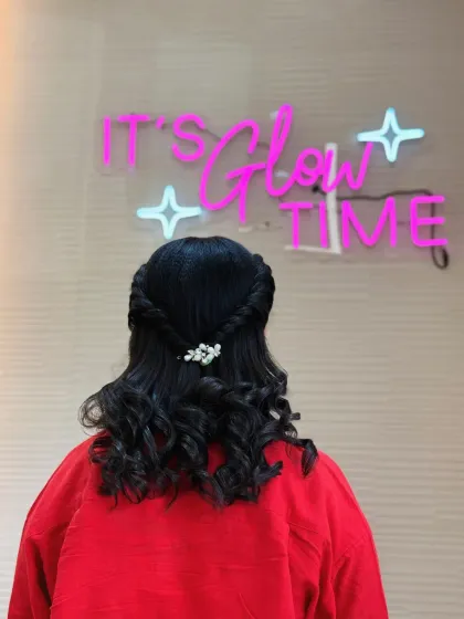 This hairstyle looks great against our signature neon sign. We love creating looks that make you feel like a star.