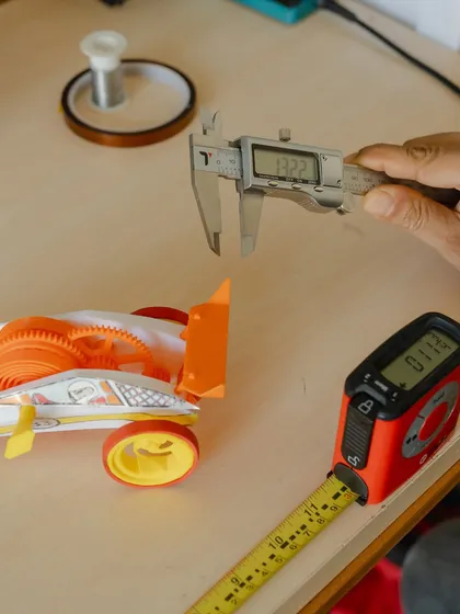 We use precise tools like digital calipers to ensure every part of our kit is perfectly designed for a successful build.