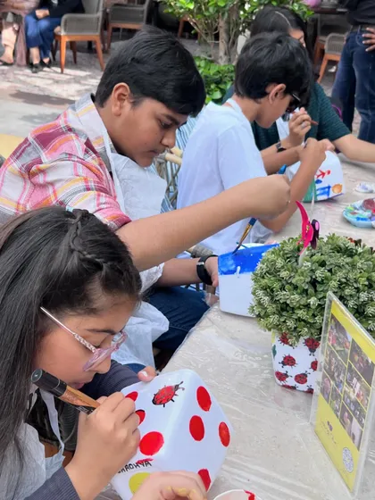 Art is for everyone, not just the little ones. Here, older kids are getting creative, showing that our painting activities are a fun and engaging experience for all age groups.