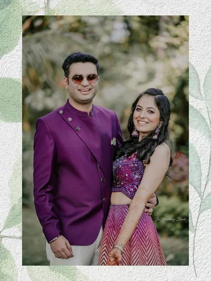 A smiling portrait of the couple at their outdoor mehendi ceremony. Dressed in vibrant colors, they radiate happiness, perfectly complementing the festive and natural setting.