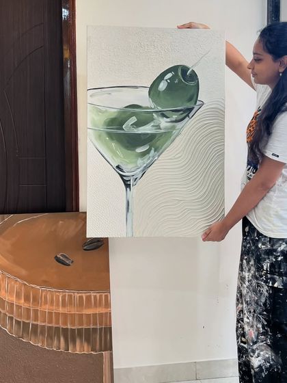 Here I am holding the finished martini painting. It's part of a diptych, paired with a coffee-themed artwork.