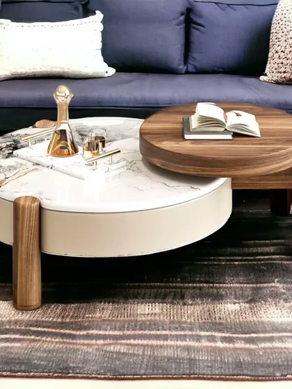 This nested coffee table is both stylish and practical. It combines a marble-finish top with a solid wood sliding top, giving you flexible surface space.