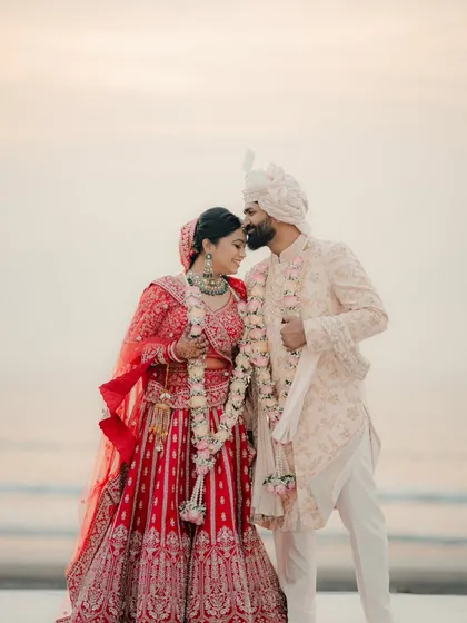 A tender forehead kiss against the warm glow of the sunset. These are the romantic, picturesque moments we specialize in at destination weddings.