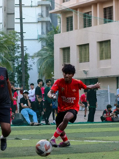 A player dribbling with precision and control under pressure from a defender in the MBPL.