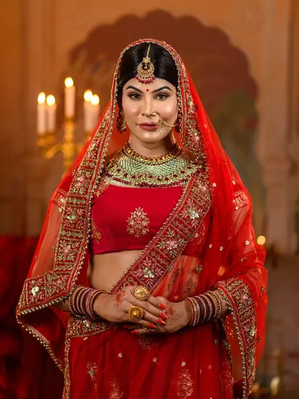 The beauty is in the details. Our Jodhabai recreation focuses on authentic Mughal bridal styling, from the rich red velvet lehenga to the delicate placement of the dupatta and the intricate traditional jewelry.
